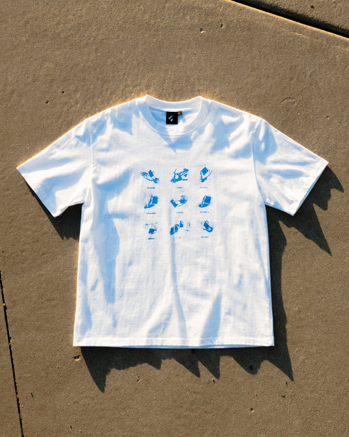 Get a Grip Tee flat lay on concrete