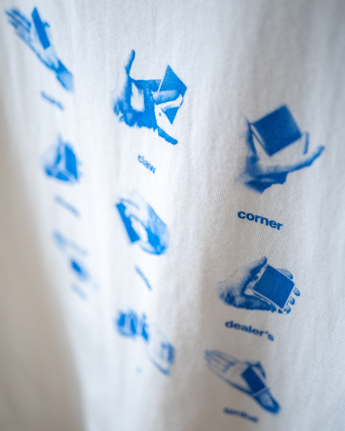 Angled close-up of the Get a Grip Tee print